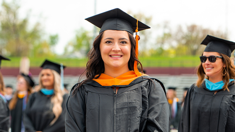 Outdoor photo of a female graduate